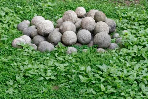 Stack of old colonial rusty cannon balls Stock Photos