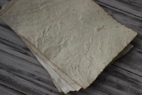 Stack of Old Crumpled Brown Paper on Wooden Slats Stock Photos