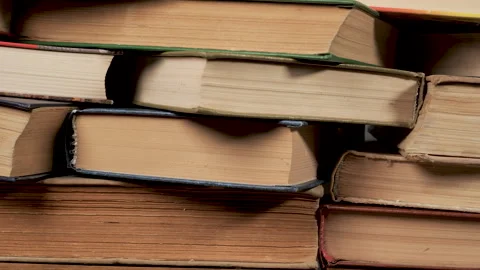 Stack of old hardcover books with aged pages in close up view Stock Footage 346062022