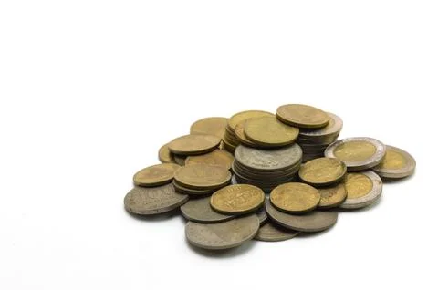 Stack of old Indonesian rupiah coins of various denominations on a white ba.. Stock Photos