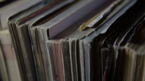 A stack of old magazines. Slow motion and close up Video stock 128409904