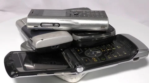 Stack of old mobile phones moving in circular motion Stock Footage 111887853