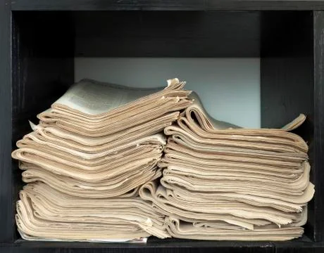 A stack of old newspapers. Stock Photos