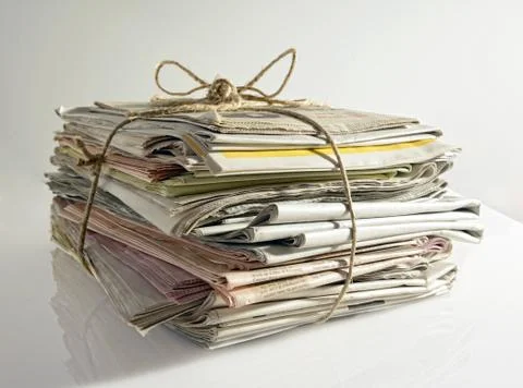 Stack of old newspapers tied with string Stock Photos