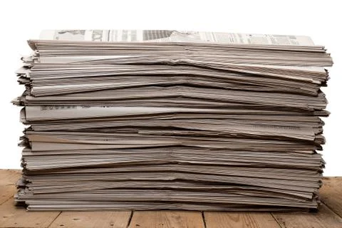 A stack of old newspapers on white background Stock Photos