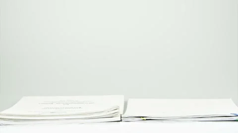 Stack old overload paperwork report on table time lapse Stock Footage 48967879