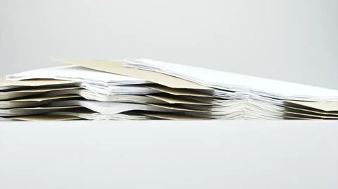 Stack old paper report and envelope on table time lapse Stock Footage 49904362