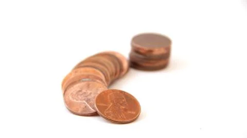 Stack of old pennies isolated on white Stock Photos
