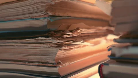 Stack of Old Rare Books with Worn Torn Pages and Frayed Edges. Antique Library Stock Footage 347481082