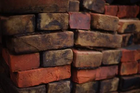 Stack of old red black bricks background Stock Photos