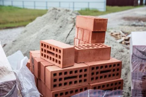 Stack of old red bricks. building of the house Stock Photos