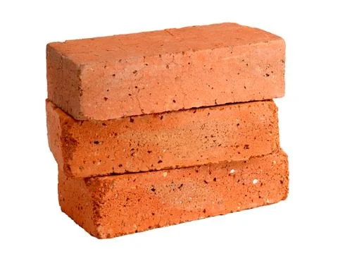 Stack of old red bricks isolated on white background Stock Photos