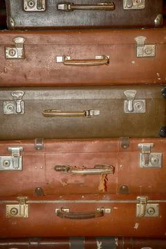 Stack of old retro suitcases close up Stock Photos