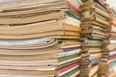 A stack of old school notebooks. Multicolored cover. Stock Photos