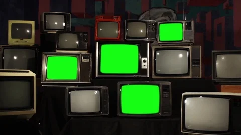 Stack of Old School TVs Turning Green Screen On and Zooming In Stock Footage 88777961