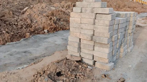Stack of Old Sidewalk Bricks beside Road in Daylight Stock Footage 314738432