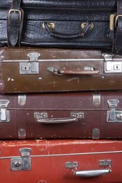 Stack of old suitcases closeup Stock Photos