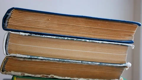 Stack of old thick shabby books or textbooks with yellowed pages Stock Footage 152772856