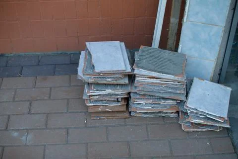 A stack of old tiles removed from the walls during the repair of the apartment Stock Photos