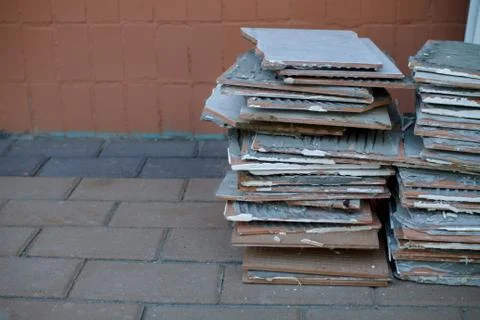 A stack of old tiles removed from the walls during the repair of the apartment Stock Photos