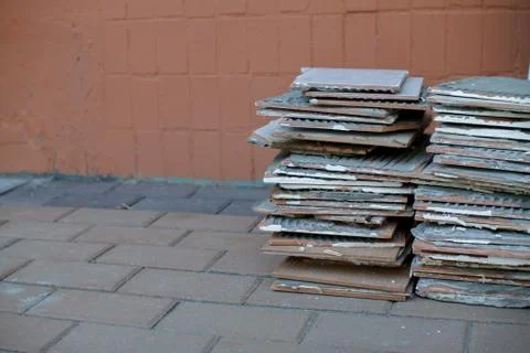 A stack of old tiles removed from the walls during the repair of the apartment Stock Photos