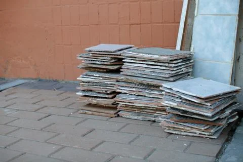 A stack of old tiles removed from the walls during the repair of the apartment Stock Photos