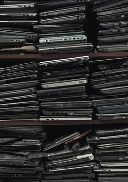 Stack of an old, used and damaded laptops Stock Photos