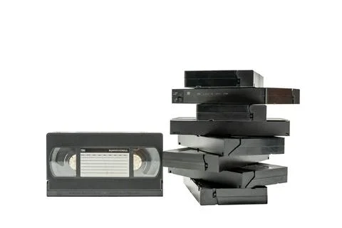 A stack of old VHS tapes are piled on top of each other Stock Illustration