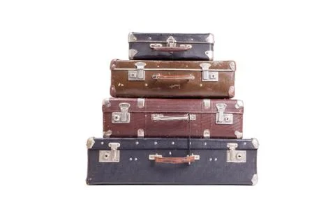 Stack of old vintage suitcases isolated on white Stock Photos