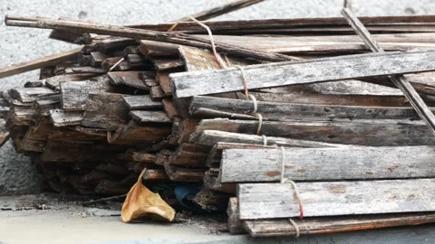 Stack of Old Weathered Wooden Planks Stored Outdoors, Rustic Construction Stock Footage 339239384