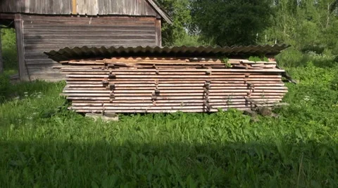 Stack of old wooden boards  in farm yard Stock Footage 51623234