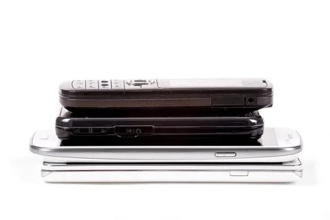 Stack of older model cell phones and smartphones Stack of older model cell... Foto stock