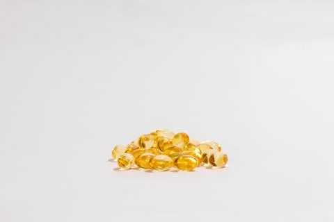 Stack of Omega 3 Capsules on white background, Fish Oil Gel Capsules. Fotos de archivo
