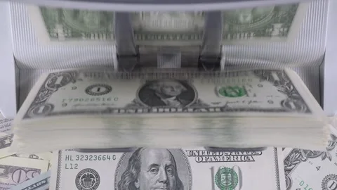 Stack Of One Dollar Bills With A Hundred Dollar Bill In The Background. Stock Footage 322521224