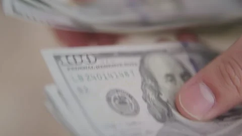 Stack of One Hundred Dollar Bills Being Counted Stock Footage 208779643