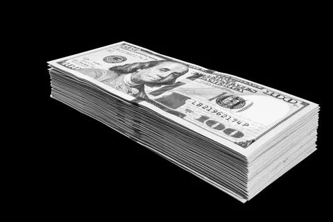 Stack of one hundred dollar bills isolated on black background. Stack of ca.. Stock Photos