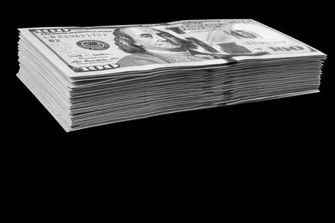 Stack of one hundred dollar bills isolated on black background. Stack of ca.. Stock Photos