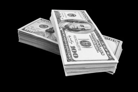 Stack of one hundred dollar bills isolated on black background. Stack of ca.. Stock Photos