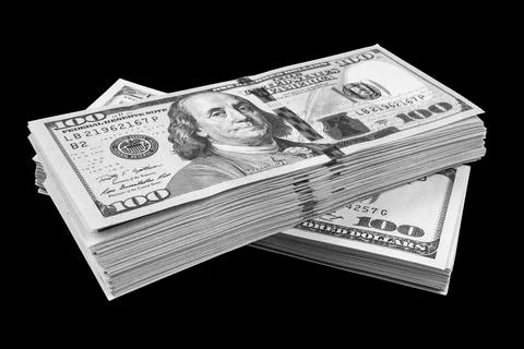 Stack of one hundred dollar bills isolated on black background. Stack of ca.. Stock Photos