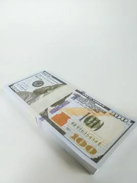 Stack of one hundred US dollar bills neatly wrapped with a paper band Stock Photos