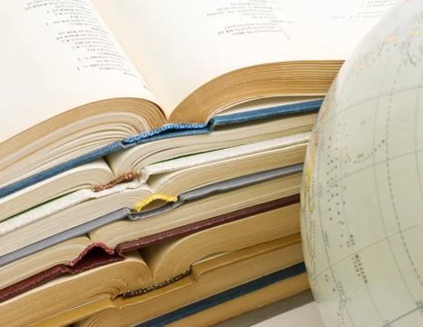 Stack of open books and globe 스톡 사진