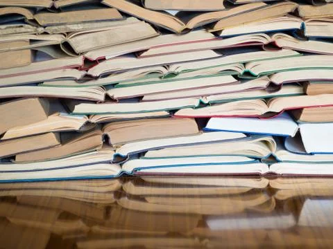 A stack of opened book, lying on the table. Knowlege and education concept. Fotos de archivo