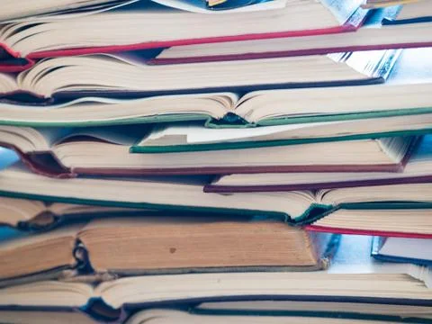 A stack of opened book, lying on the table. Knowlege and education concept. Foto stock