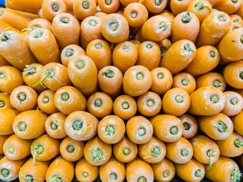 Stack of orange carrots in a market Foto stock