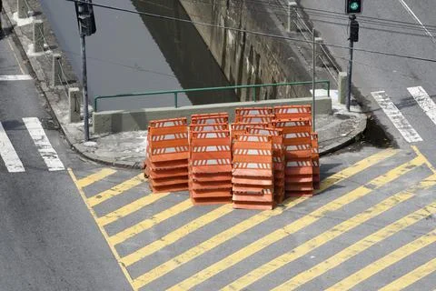 Stack of orange cones for traffic closure on city street Stockfoto's