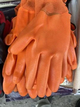 Stack of Orange Industrial Work Gloves Stock Photos