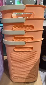 Stack of Orange Laundry Baskets with Beige Handles, Home Organization. Stock Photos