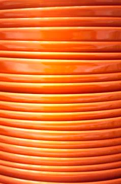 Stack of orange plates close-up Stock Photos