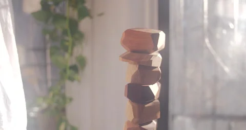 Stack of organically shaped wooden blocks in sunlight Stock Footage 169709468