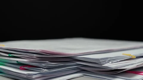 Stack overload document report paper on black background Stock Footage 238015957